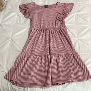 Girls pink dress with white stripes and ruffle sleeves.